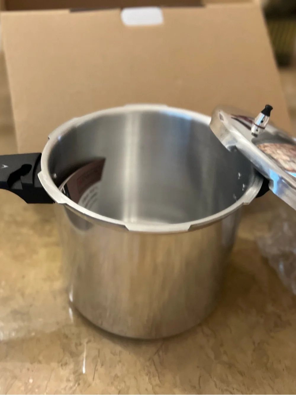 New - 6 Quart Stainless Steel Pressure Cooker with Black Handles